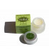 Open glass jar with organic olive oil based white lip balm and green cardboard packaging