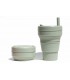 Pretty collapsed Stojo cup with unfolded Stojo cup 470 ml green